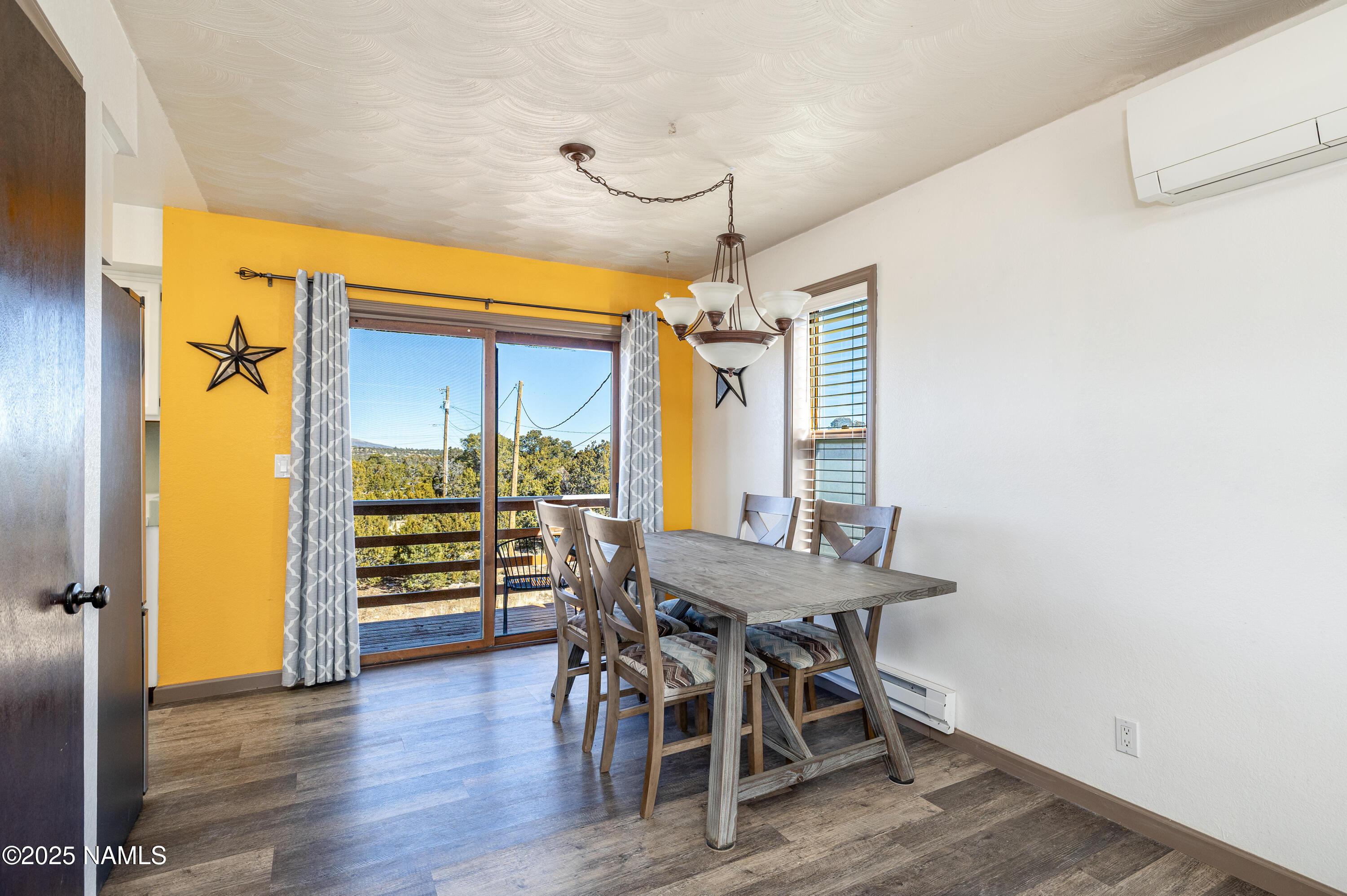 5966 East Camden Road Flagstaff, AZ 86004 - Photo 18 of 70 a view of a dining room with furniture and wooden floor