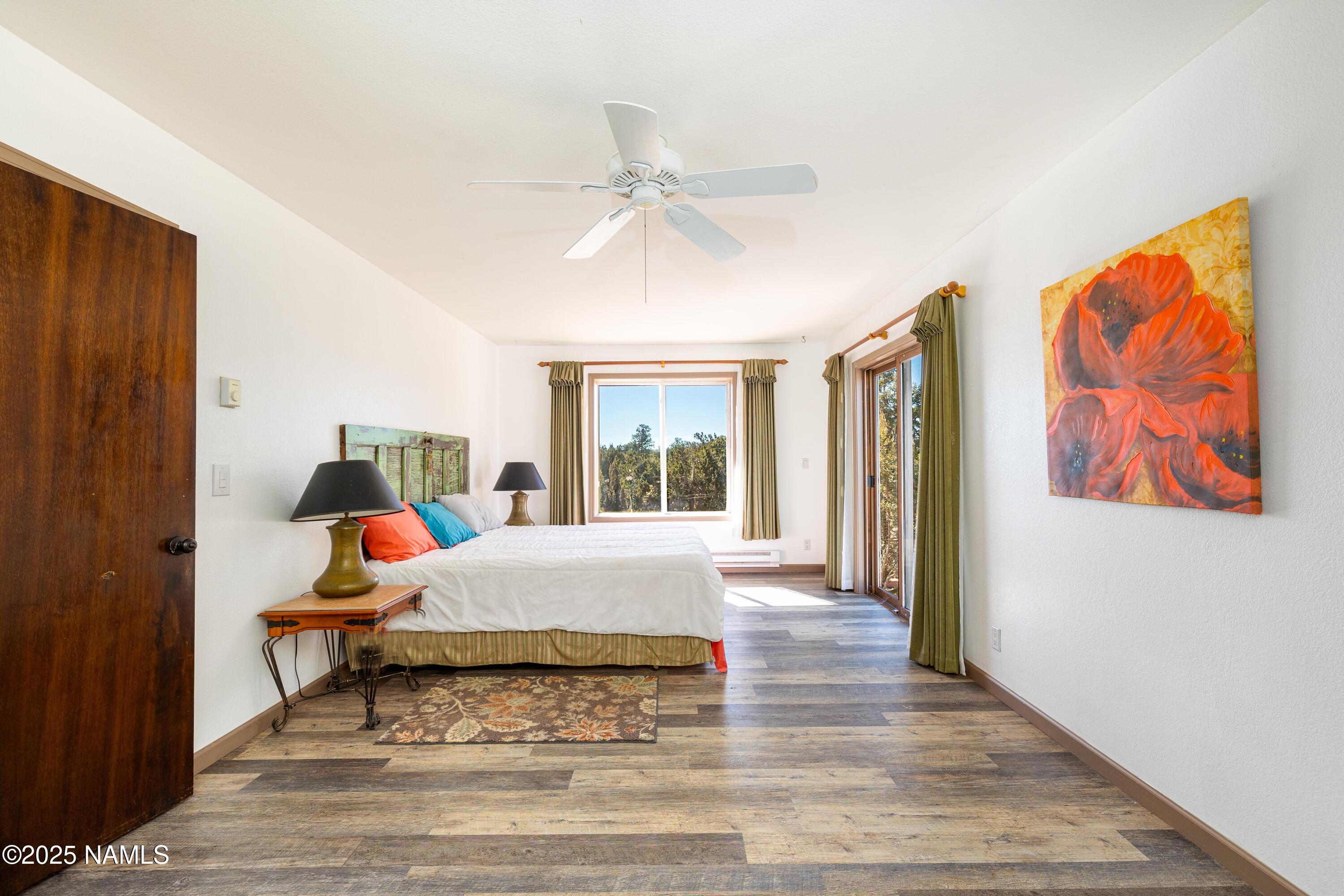 5966 East Camden Road Flagstaff, AZ 86004 - Photo 22 of 70 a living room with a bed furniture and a window