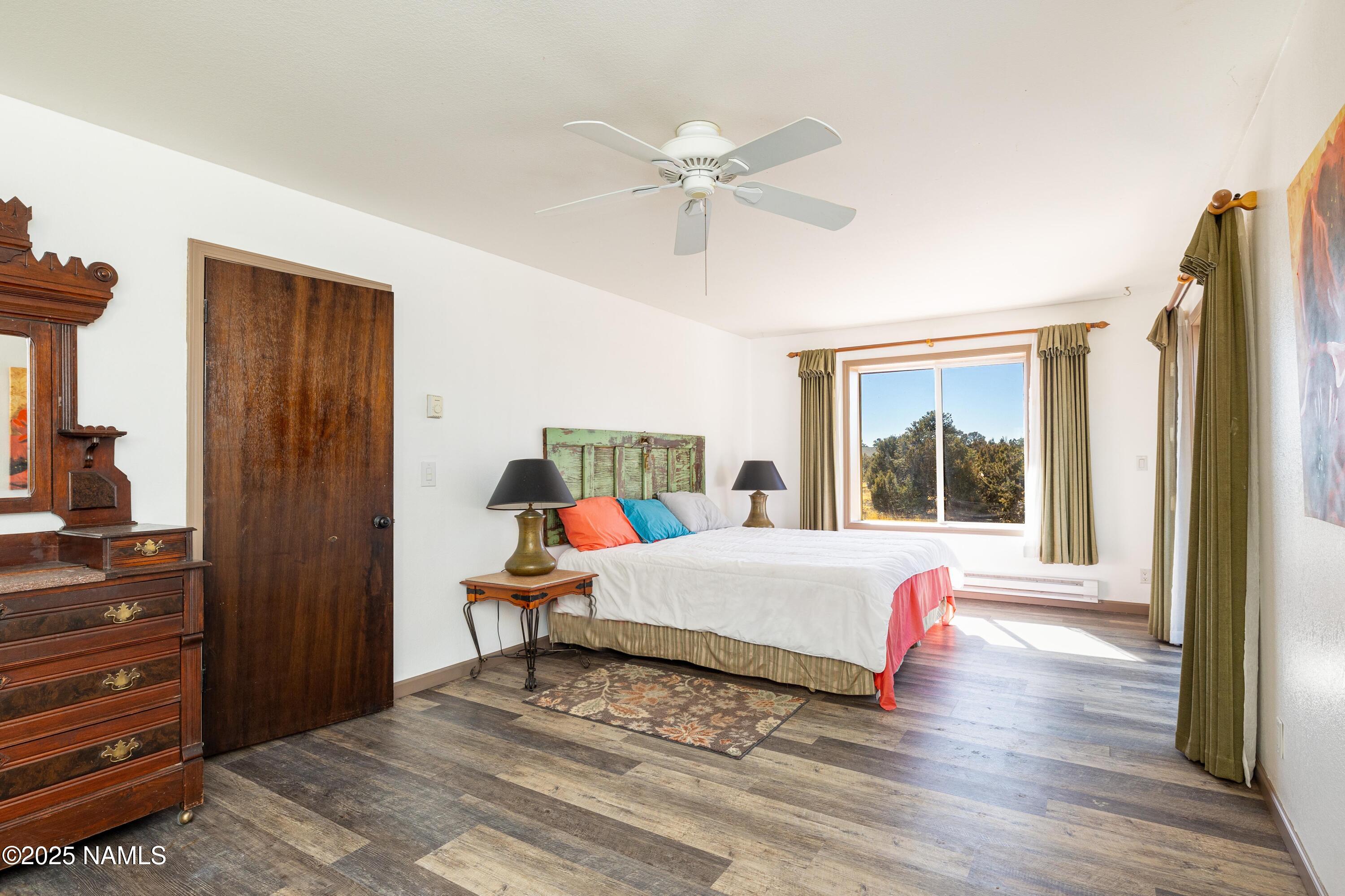 5966 East Camden Road Flagstaff, AZ 86004 - Photo 23 of 70 a room with a bed and a window