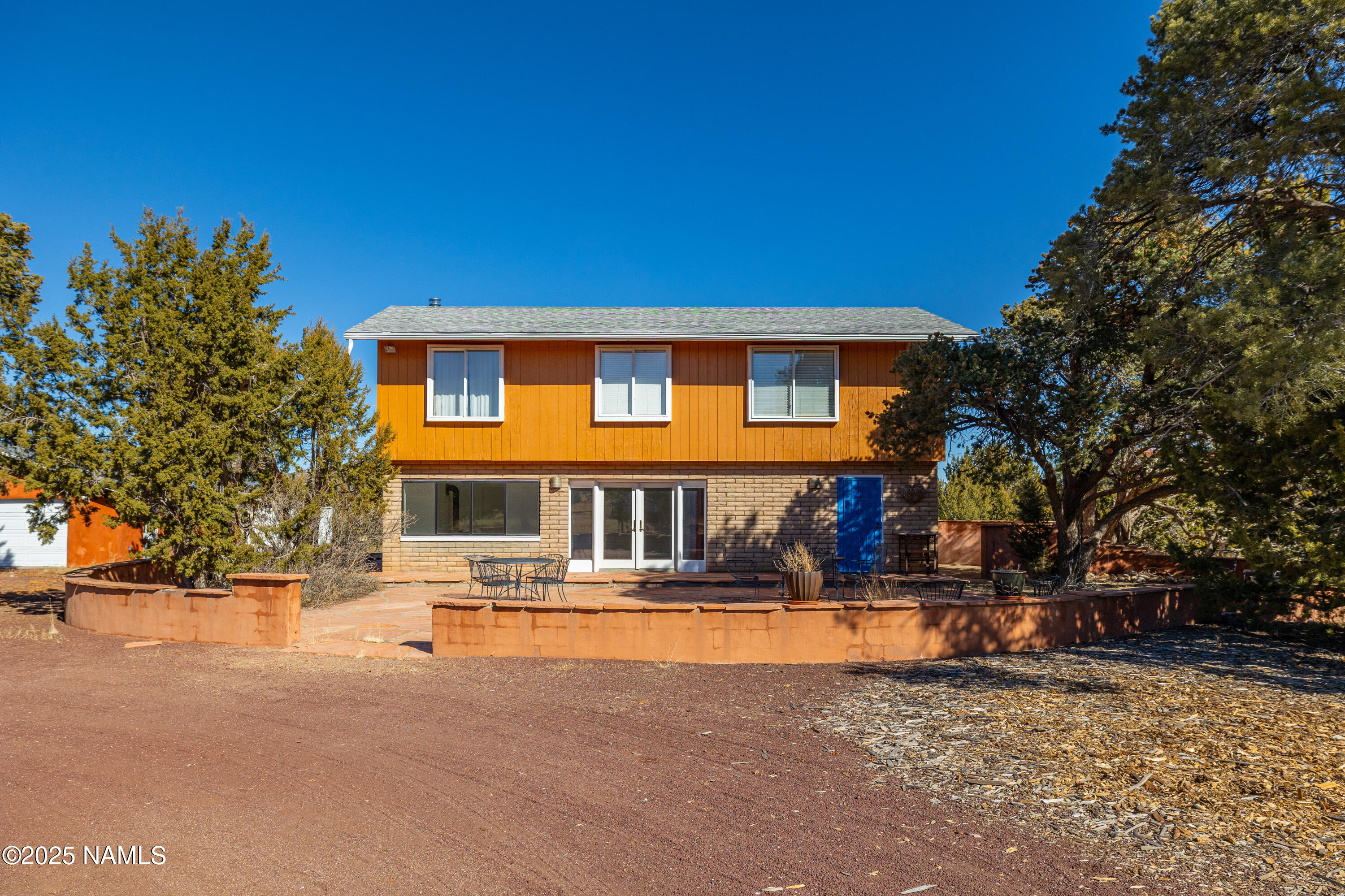 5966 East Camden Road Flagstaff, AZ 86004 - Photo 3 of 70 a front view of a house with street view