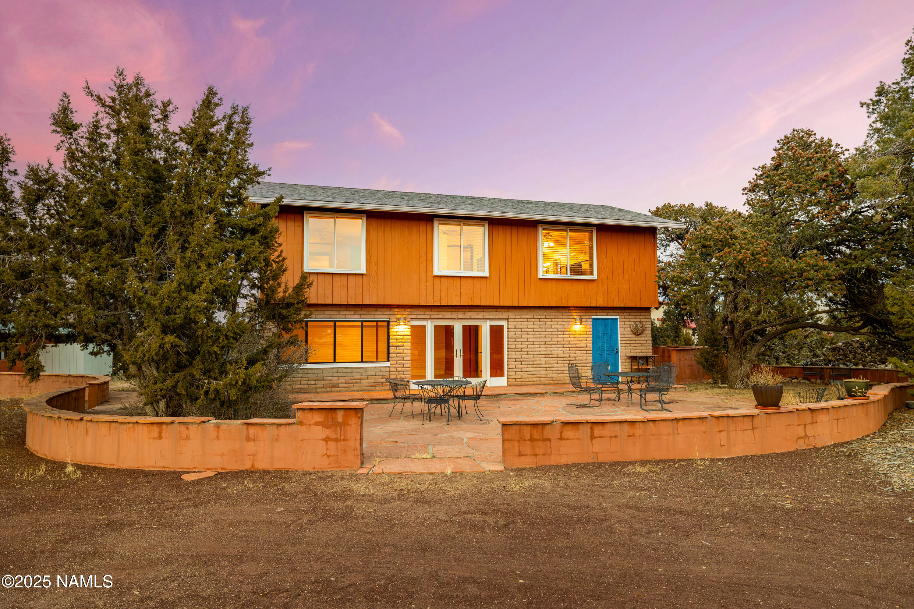 5966 East Camden Road Flagstaff, AZ 86004 - Photo 48 of 70 a front view of a house with swimming pool and a yard