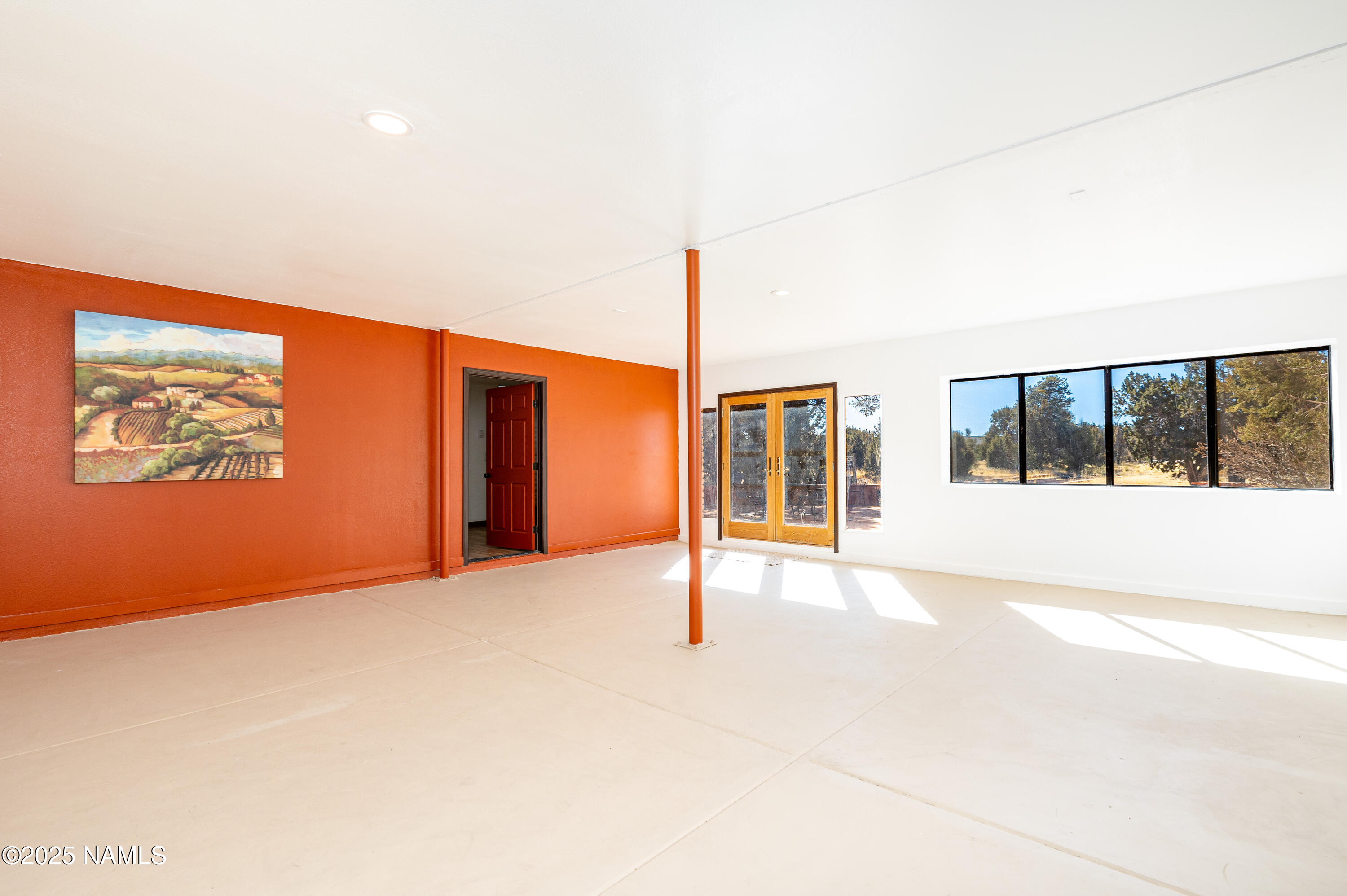 5966 East Camden Road Flagstaff, AZ 86004 - Photo 5 of 70 a view of an empty room with a window