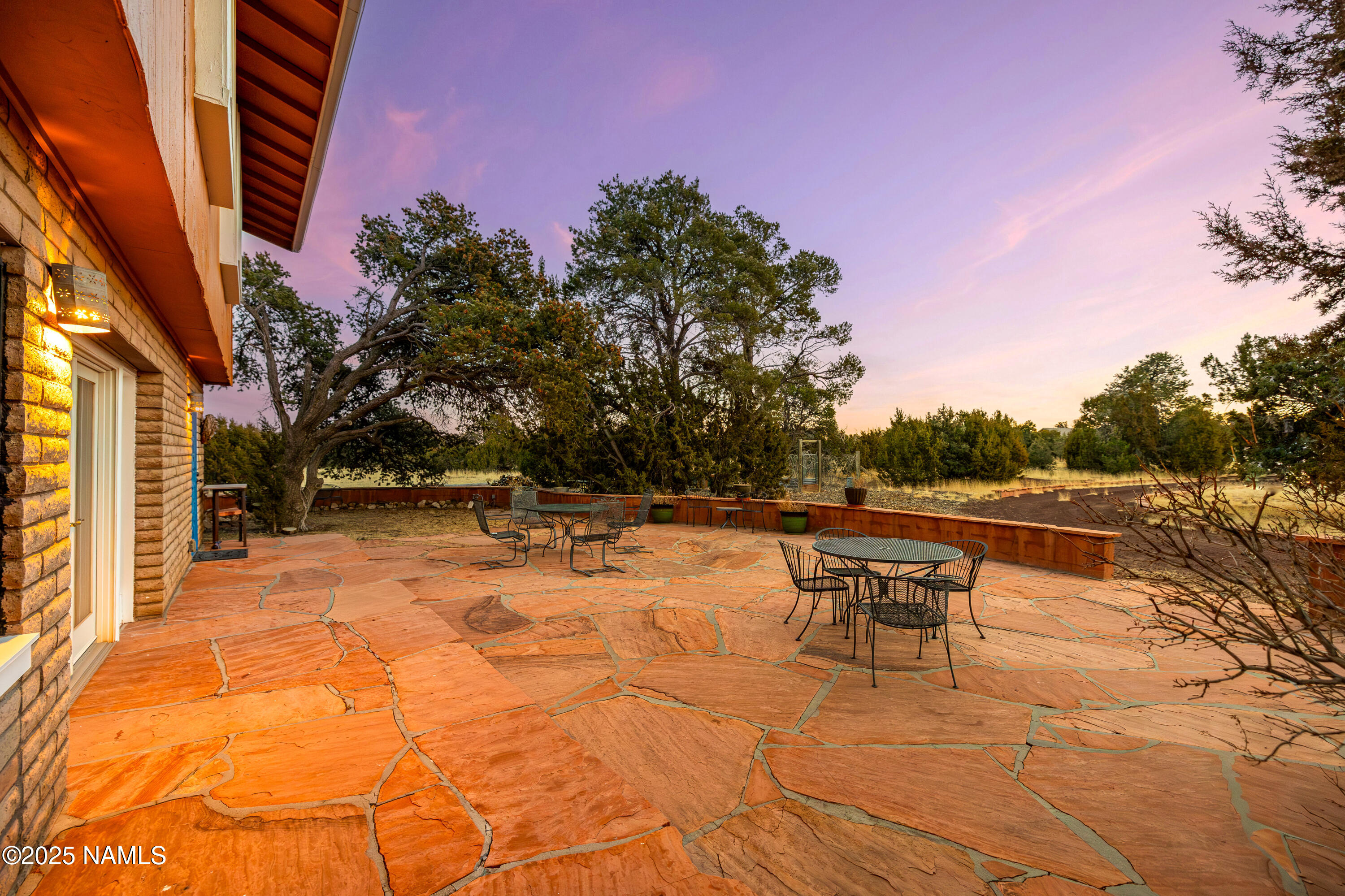 5966 East Camden Road Flagstaff, AZ 86004 - Photo 51 of 70 a backyard of a house with table and chairs