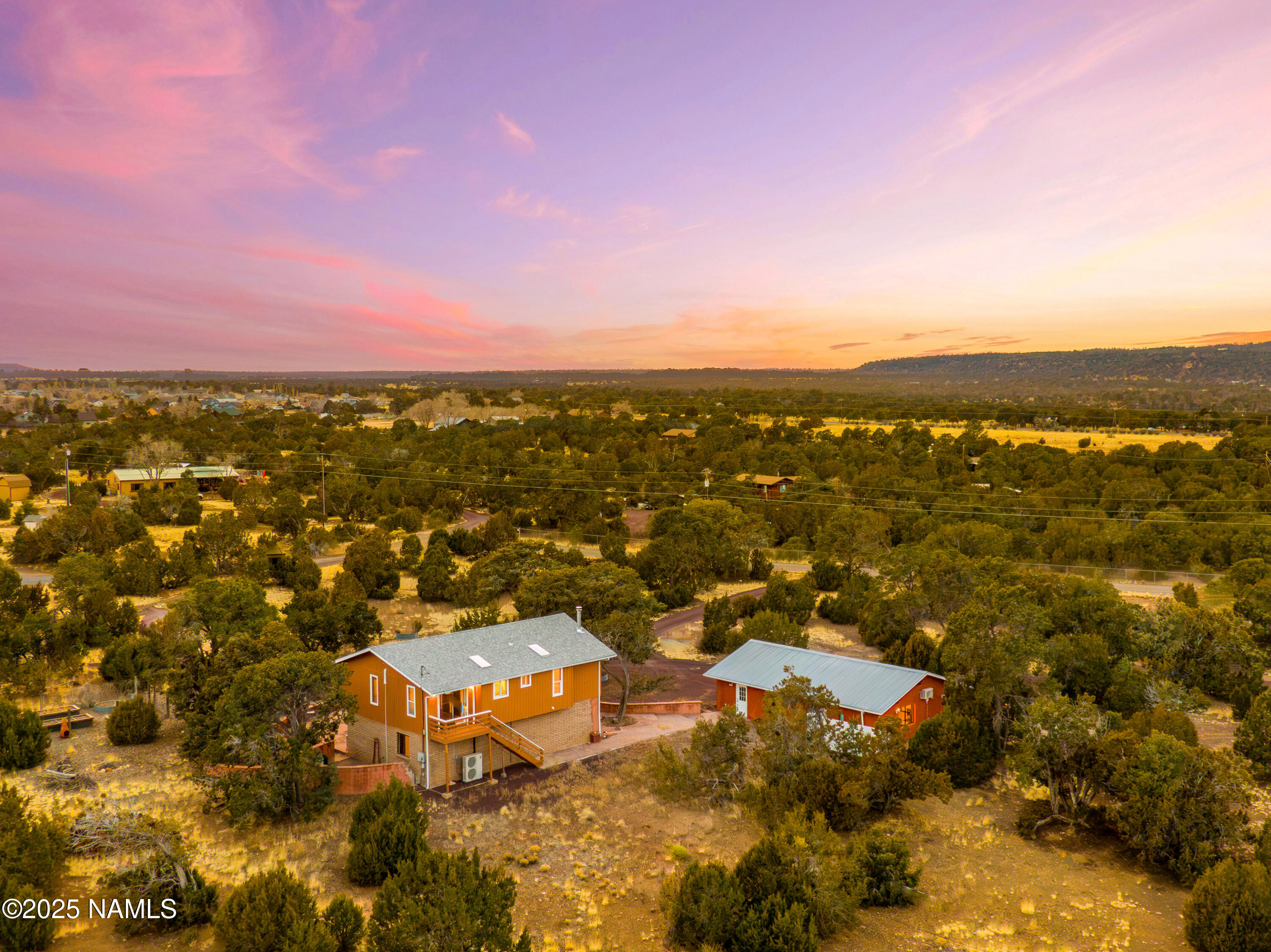 5966 East Camden Road Flagstaff, AZ 86004 - Photo 58 of 70 an aerial view of residential houses with outdoor space and trees