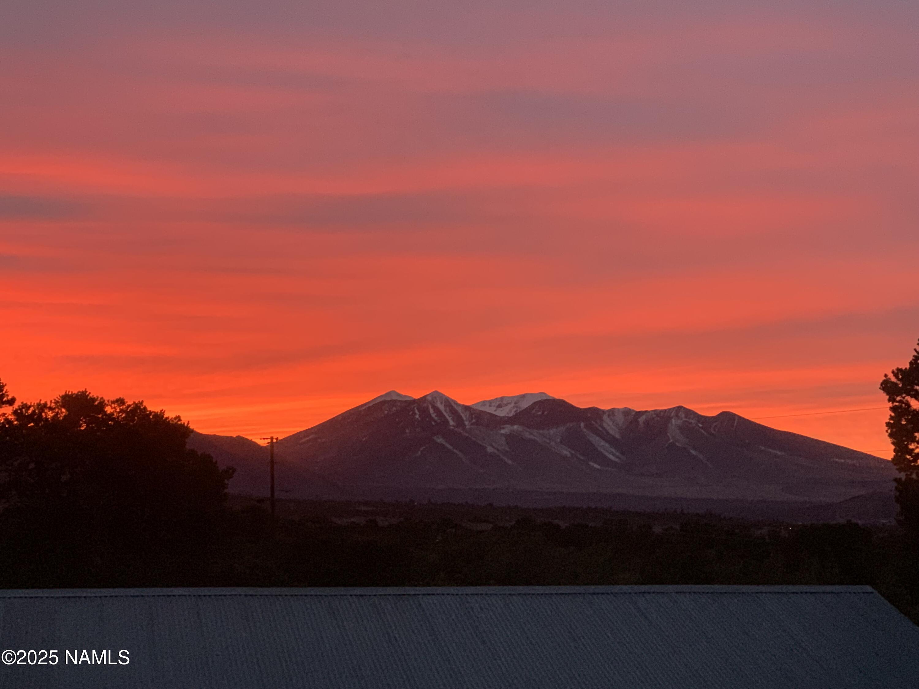 5966 East Camden Road Flagstaff, AZ 86004 - Photo 70 of 70 a view of large house with a mountain in the background