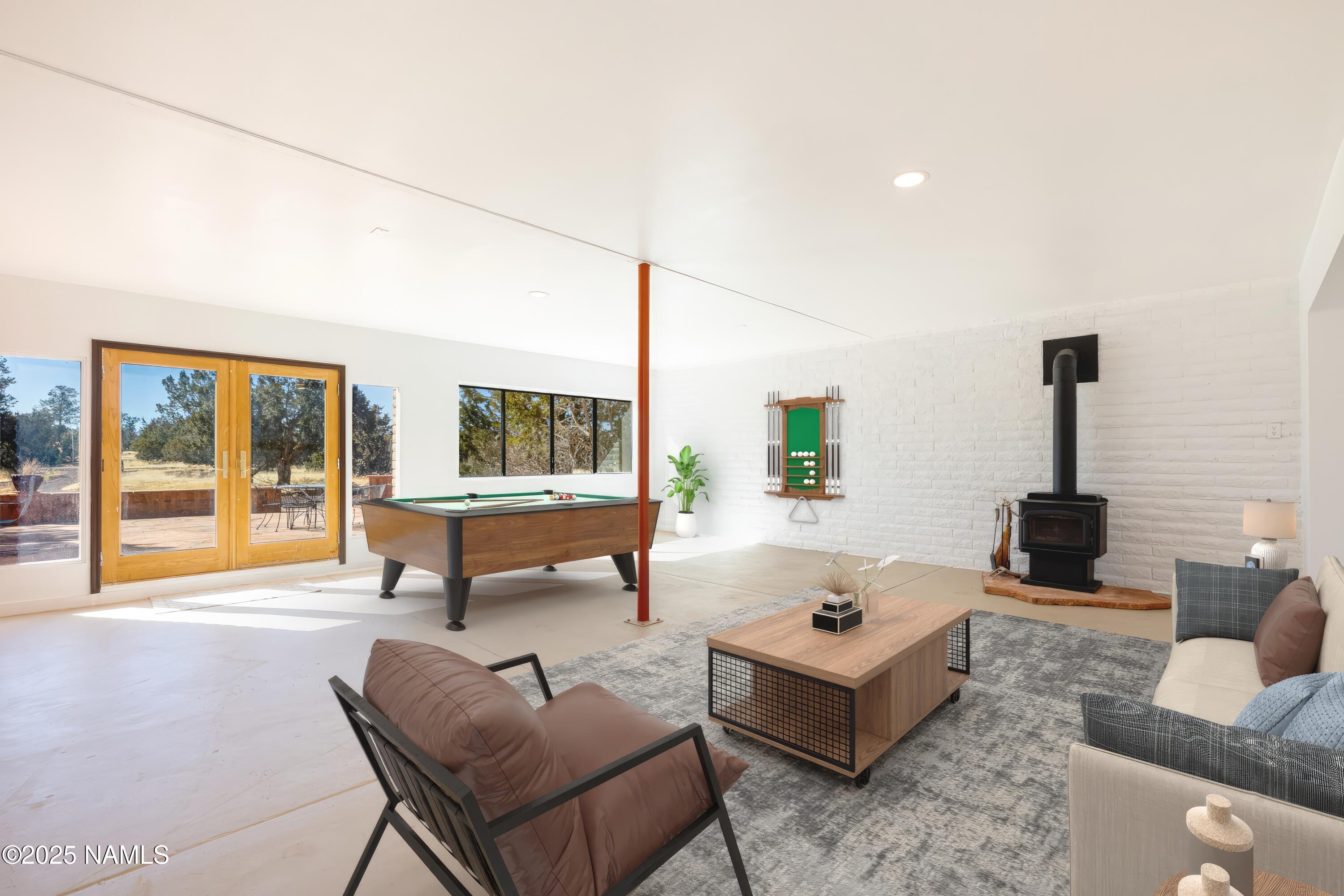5966 East Camden Road Flagstaff, AZ 86004 - Photo 8 of 70 a living room with furniture and a large window