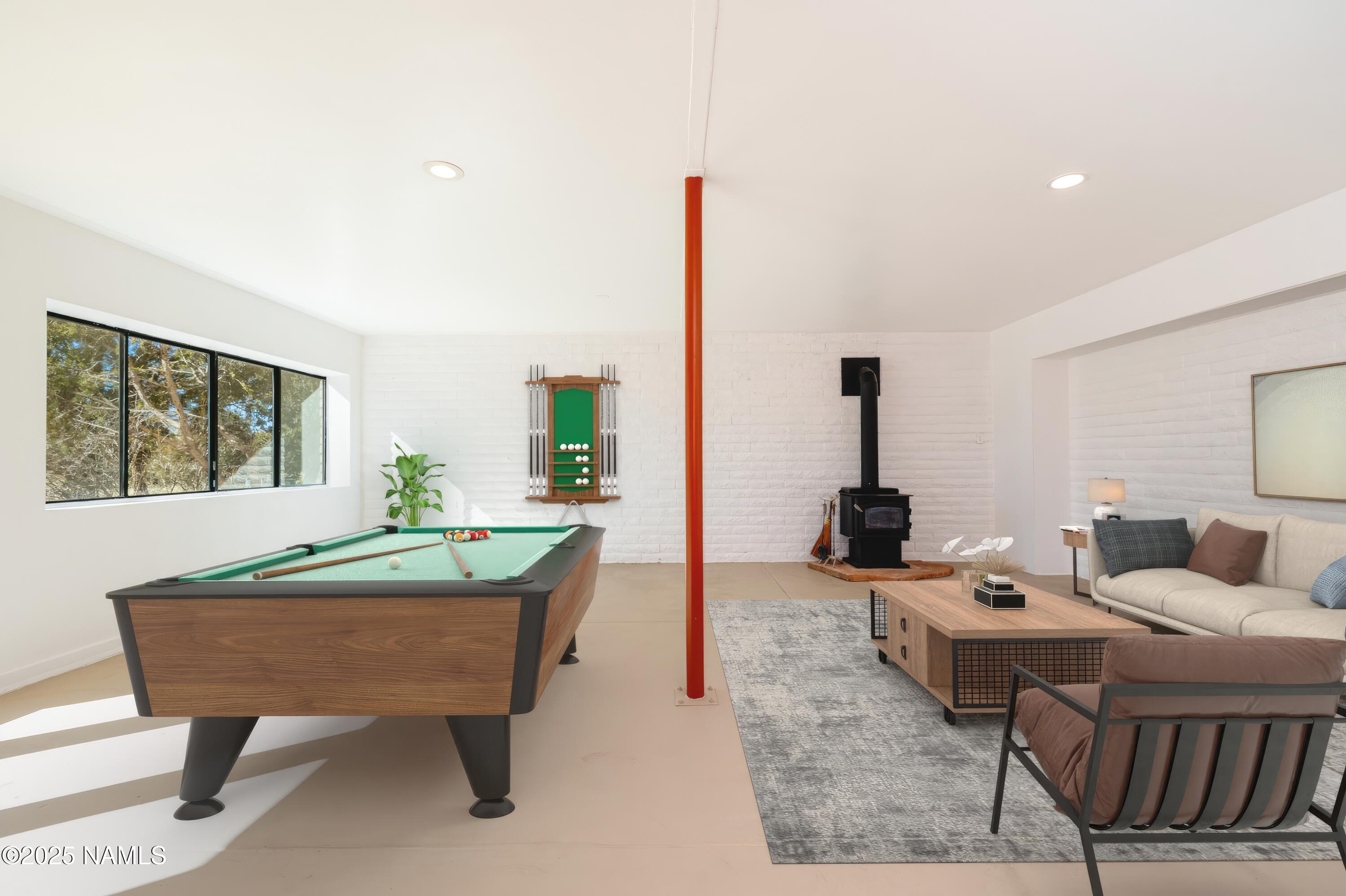 5966 East Camden Road Flagstaff, AZ 86004 - Photo 10 of 70 a living room with furniture and a window