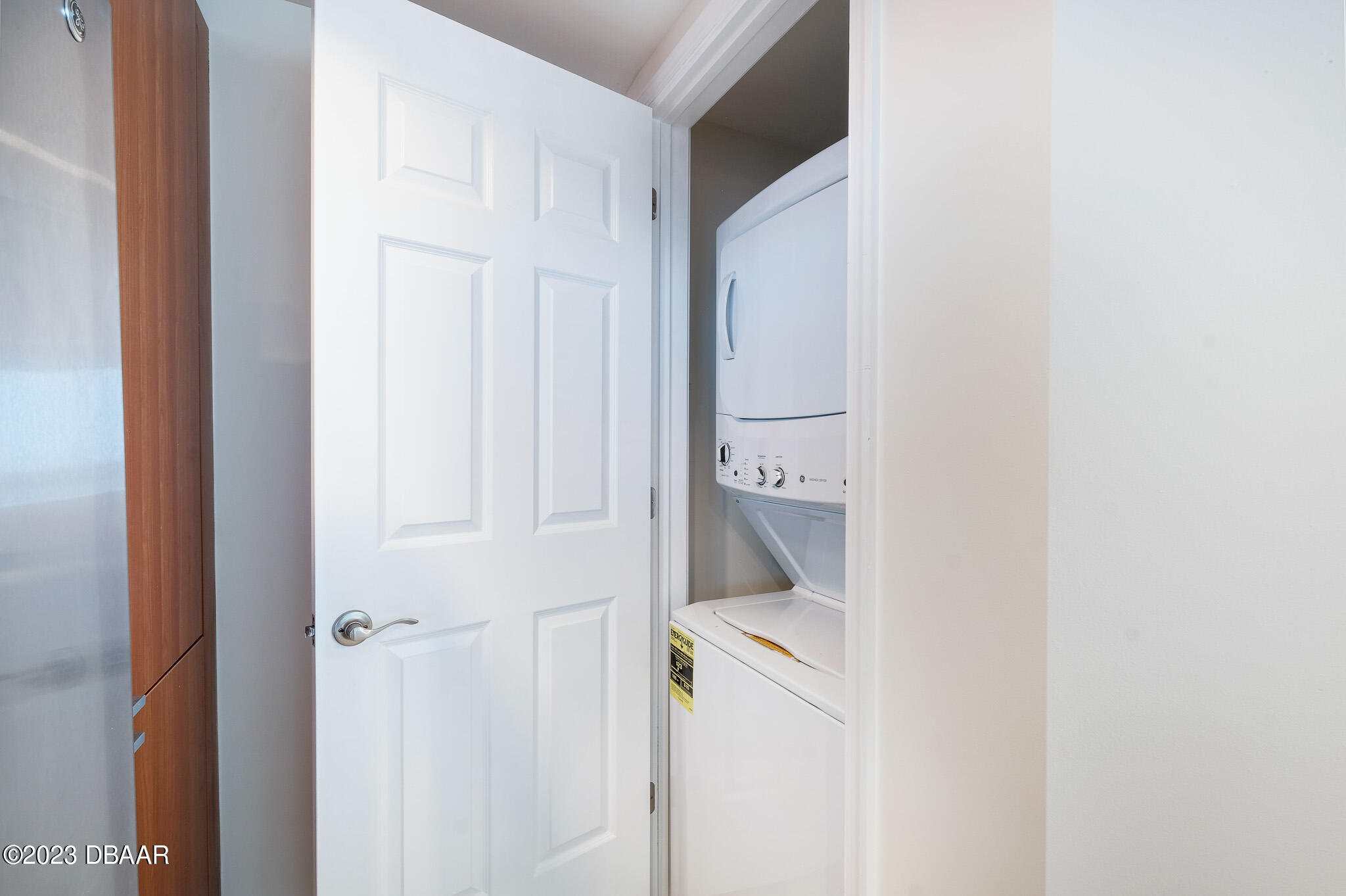 241 Riverside Drive, Unit 1006 Daytona Beach, FL 32117 - Photo 43 of 43 washer dryer in kitchen