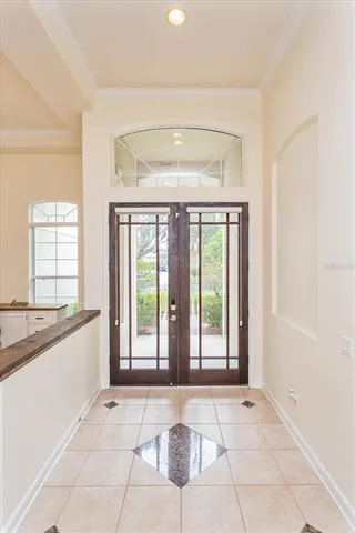 a view of an entryway with a kitchen