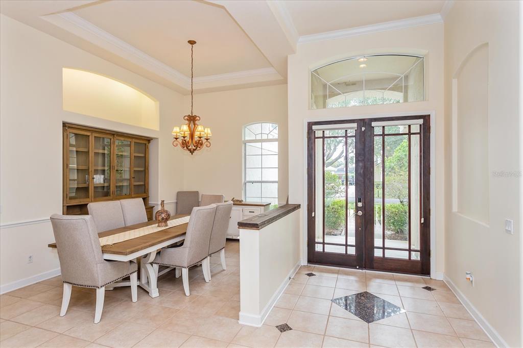 10606 Boca Pointe Drive Orlando, FL 32836 - Photo 12 of 39 a dining room with furniture and window