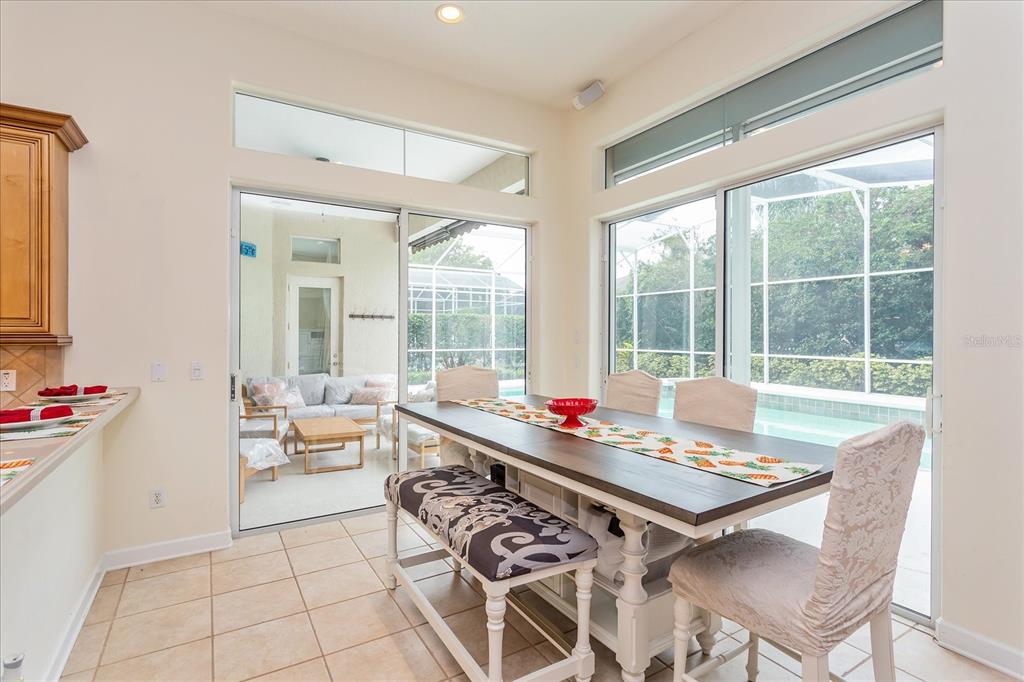 10606 Boca Pointe Drive Orlando, FL 32836 - Photo 20 of 39 a view of a workspace with furniture and a large window