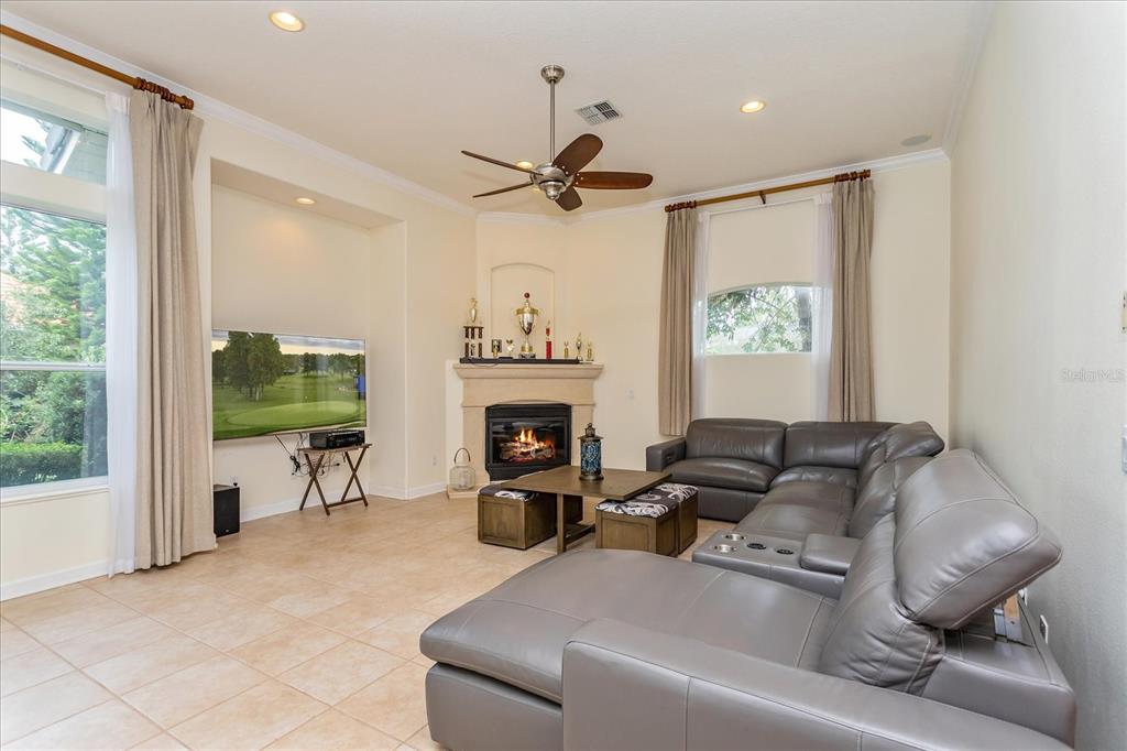10606 Boca Pointe Drive Orlando, FL 32836 - Photo 21 of 39 a living room with furniture and a fireplace