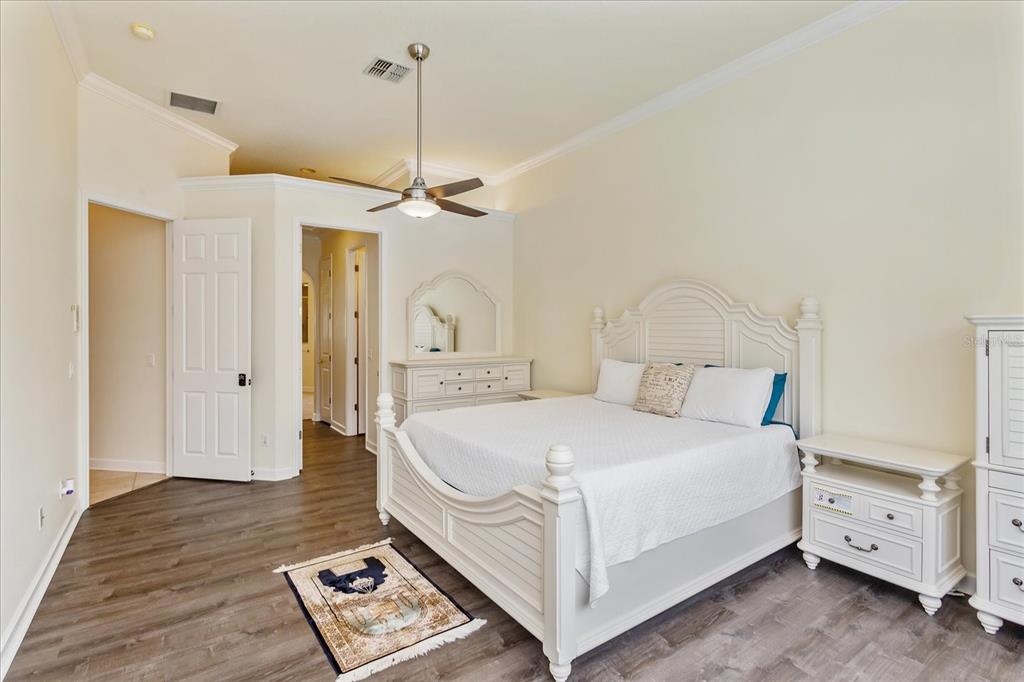 10606 Boca Pointe Drive Orlando, FL 32836 - Photo 25 of 39 a bedroom with a bed and a table