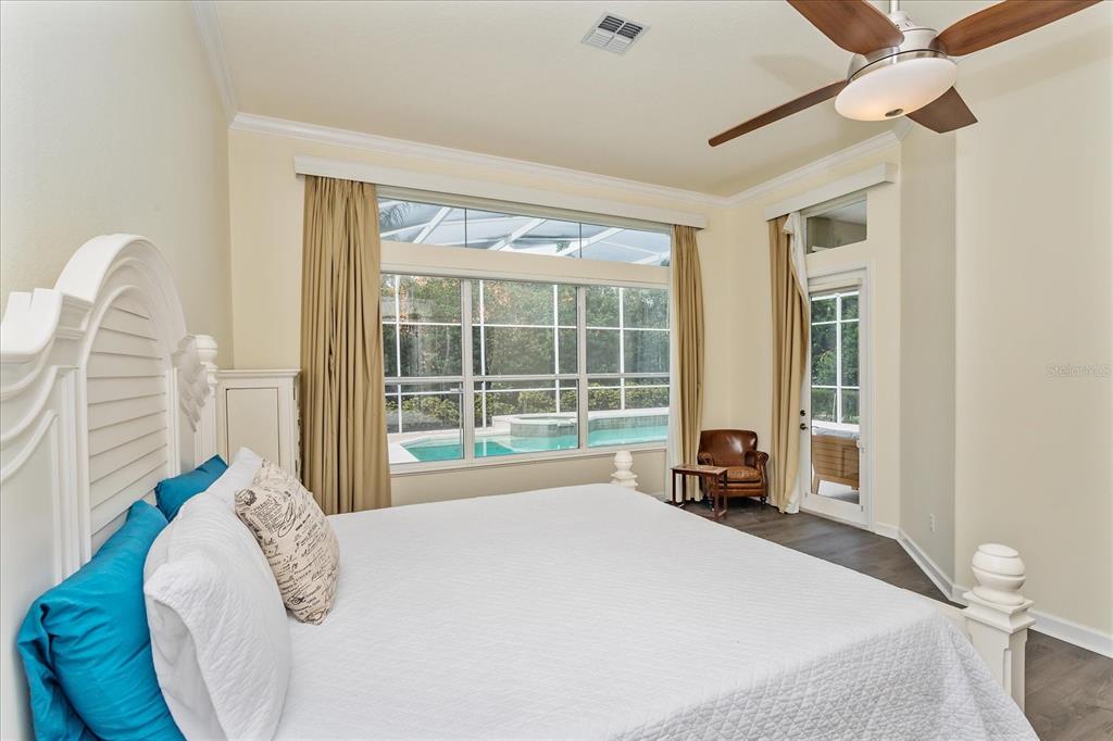 10606 Boca Pointe Drive Orlando, FL 32836 - Photo 26 of 39 a bed sitting in a bedroom next to a window