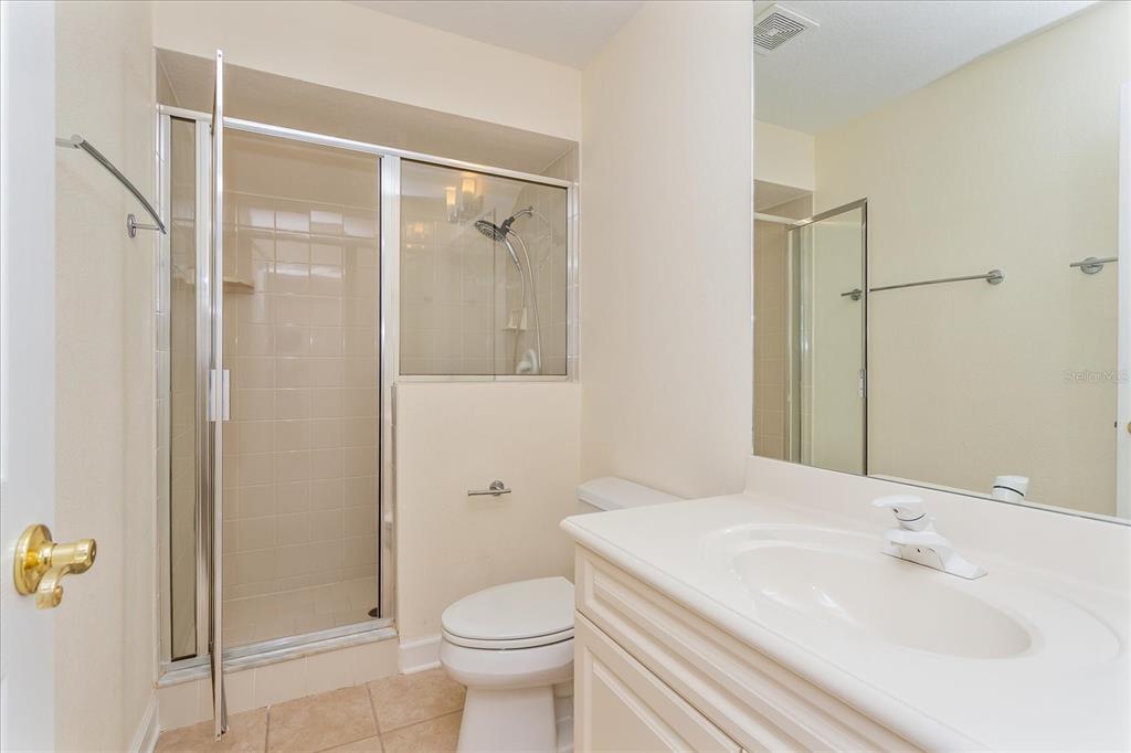 10606 Boca Pointe Drive Orlando, FL 32836 - Photo 32 of 39 a bathroom with a sink toilet and shower