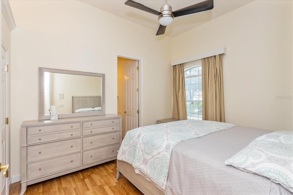 10606 Boca Pointe Drive Orlando, FL 32836 - Photo 34 of 39 a bedroom with a large bed and a dresser