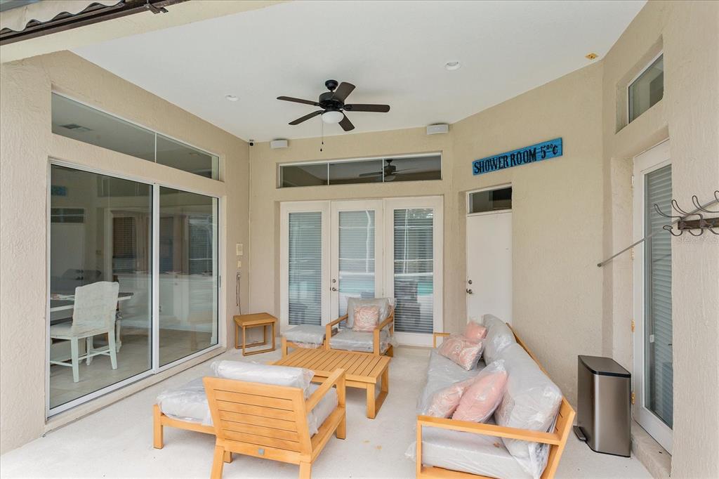10606 Boca Pointe Drive Orlando, FL 32836 - Photo 37 of 39 a outdoor space with patio the couches and a dining table with the view of the house