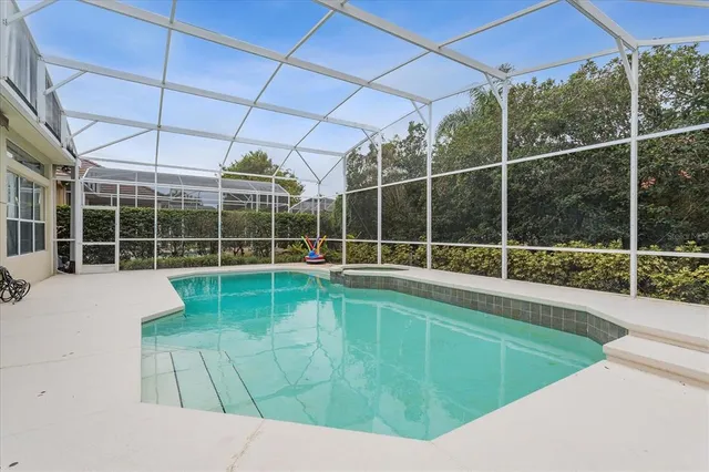 a view of a backyard with a swimming pool