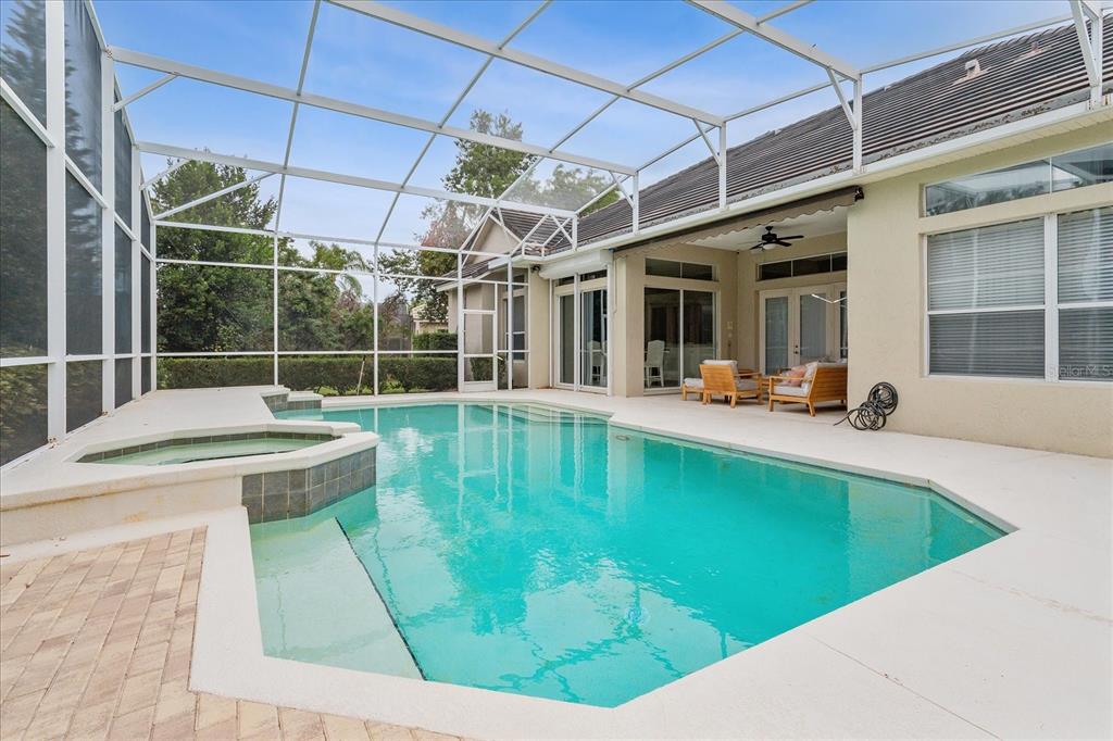 10606 Boca Pointe Drive Orlando, FL 32836 - Photo 39 of 39 a view of a swimming pool with a patio and a yard