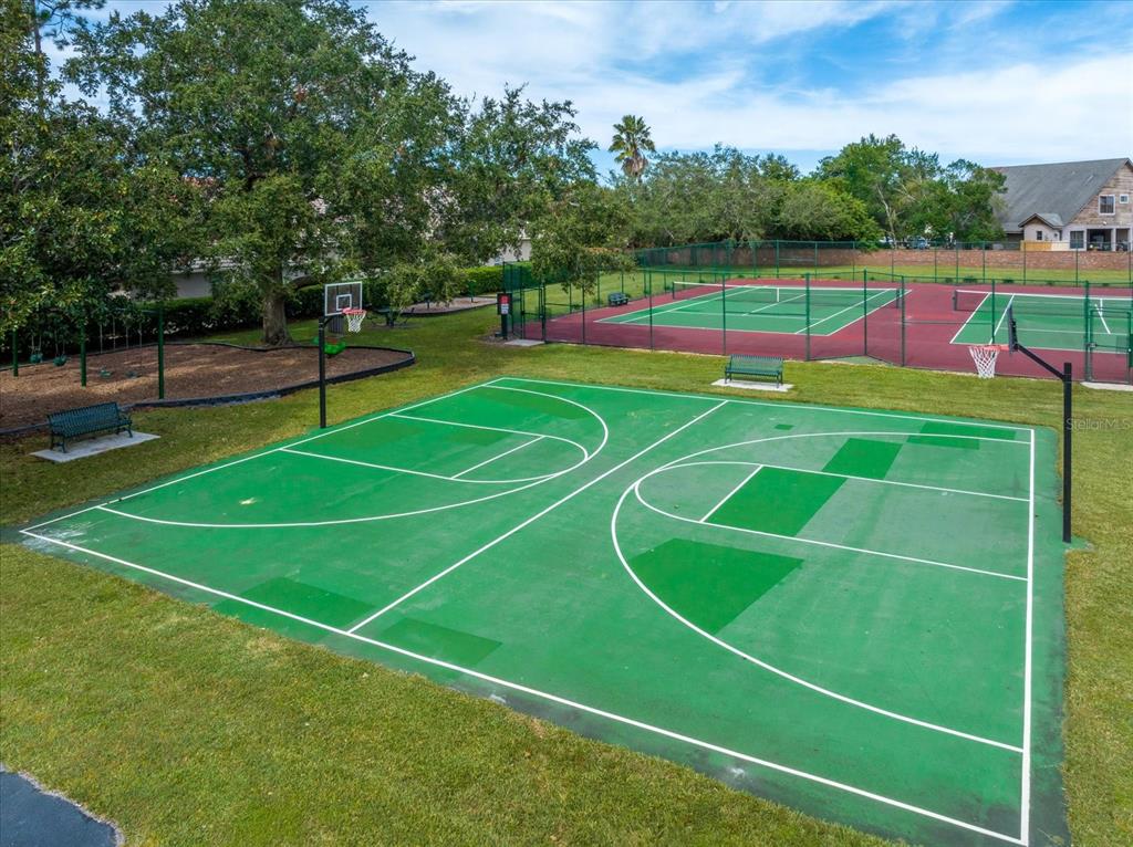 10606 Boca Pointe Drive Orlando, FL 32836 - Photo 6 of 39 a tennis court that has tennis net