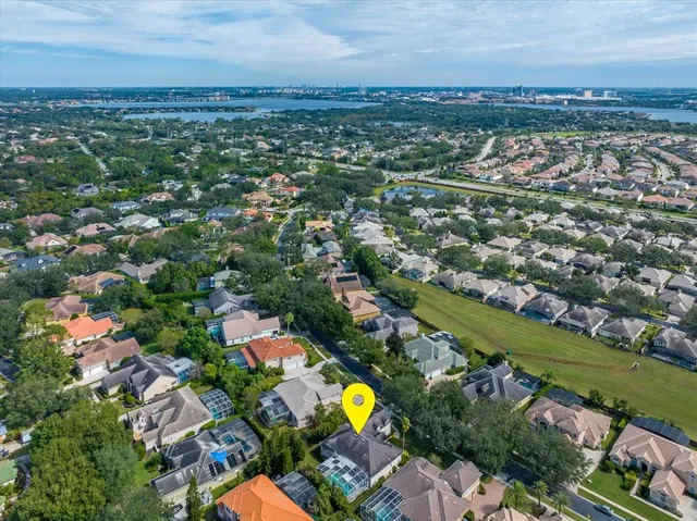 an aerial view of residential building with outdoor space and swimming pool