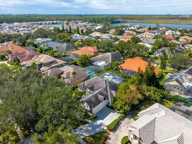an aerial view of residential houses with outdoor space