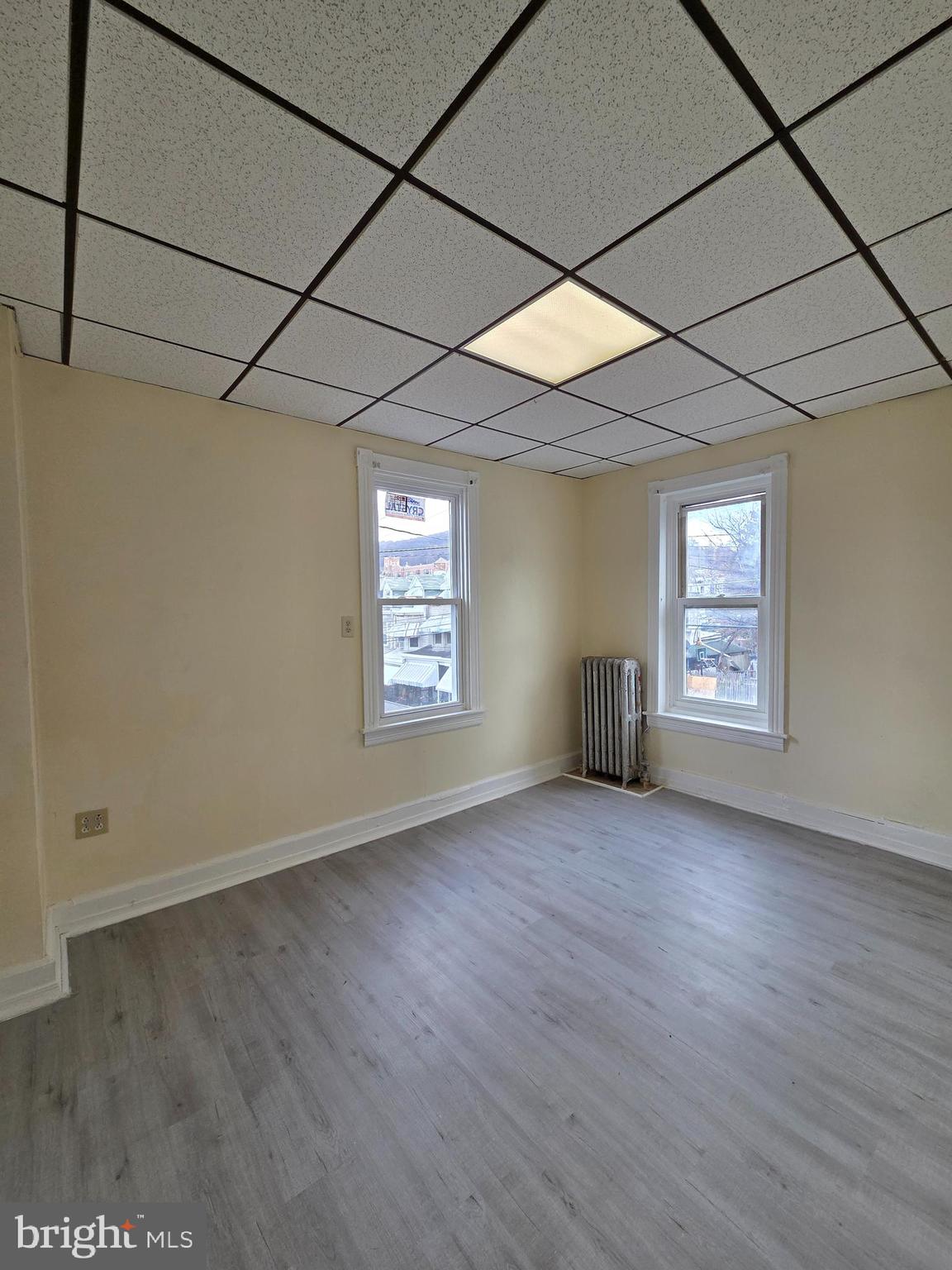 1135 Cotton Street Reading, PA 19602 - Photo 11 of 17 an empty room with windows