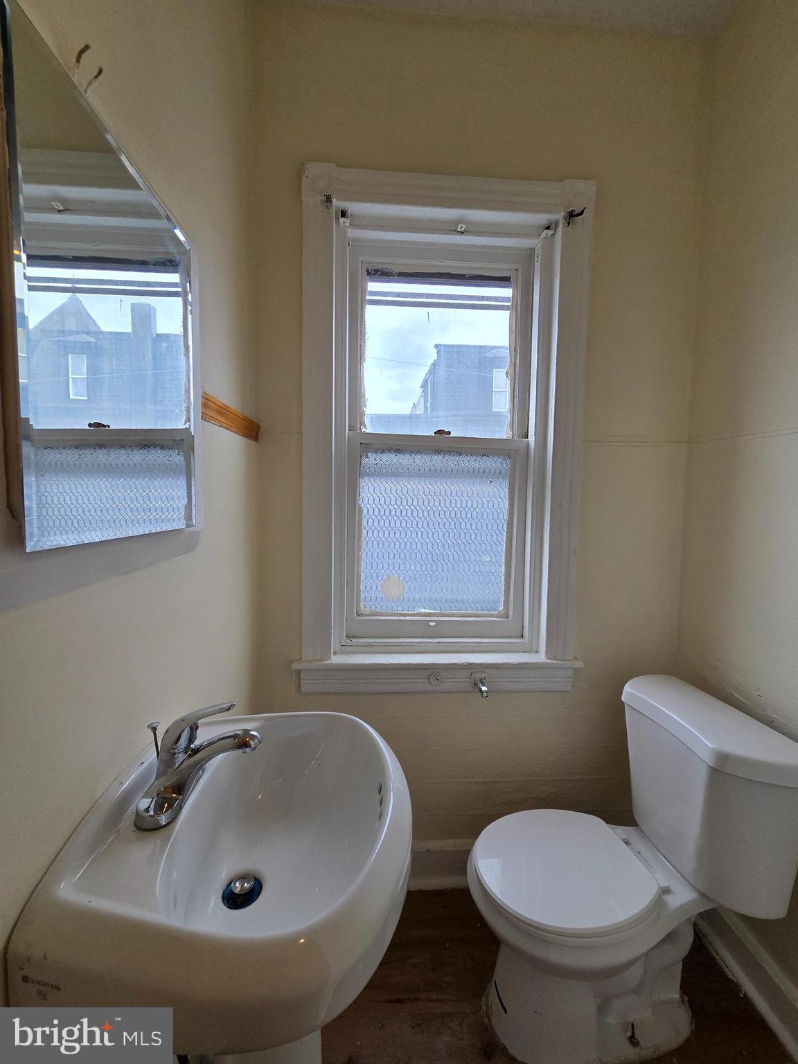 1135 Cotton Street Reading, PA 19602 - Photo 13 of 17 a bathroom with a sink and a toilet