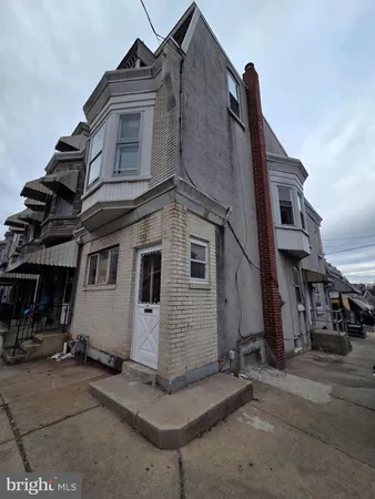 a view of a house with a street