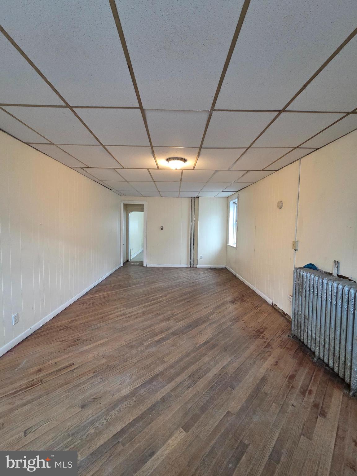 1135 Cotton Street Reading, PA 19602 - Photo 4 of 17 a view of empty room with wooden floor