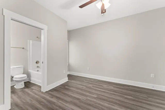 a view of a bathroom with wooden floor