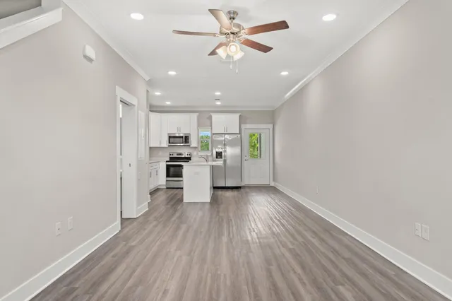 a view of kitchen with wooden floor and window