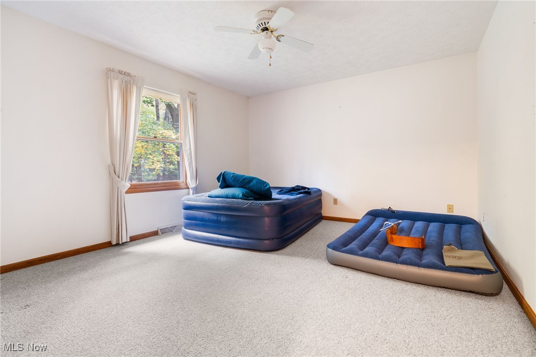 4057 Etter Road Mogadore, OH 44260 - Photo 23 of 41 Carpeted bedroom featuring ceiling fan
