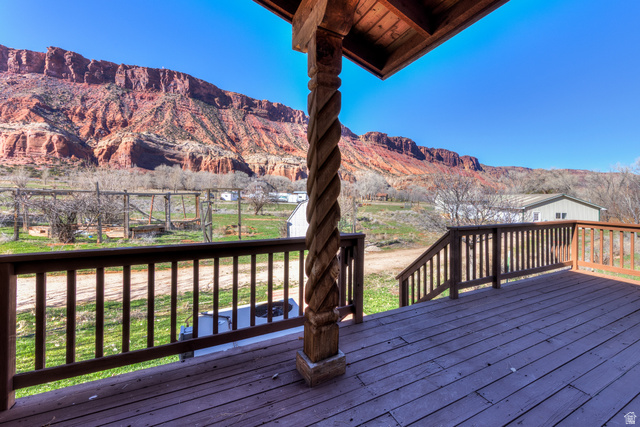 423 Amber Lane Moab, UT 84532 - Photo 43 of 63 Hand carved wooded post with view of Porcupine Rim.