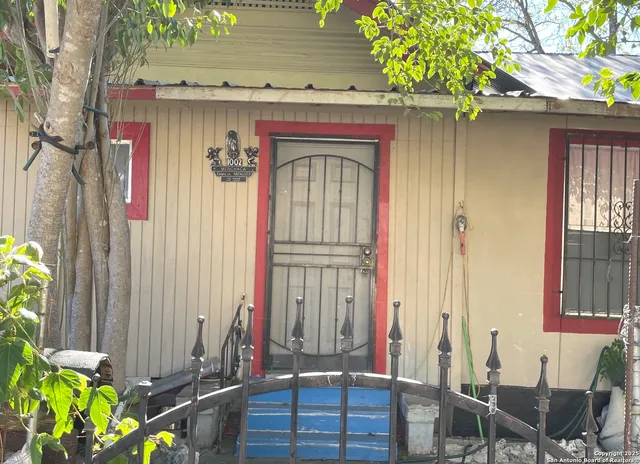a front view of a house with chairs