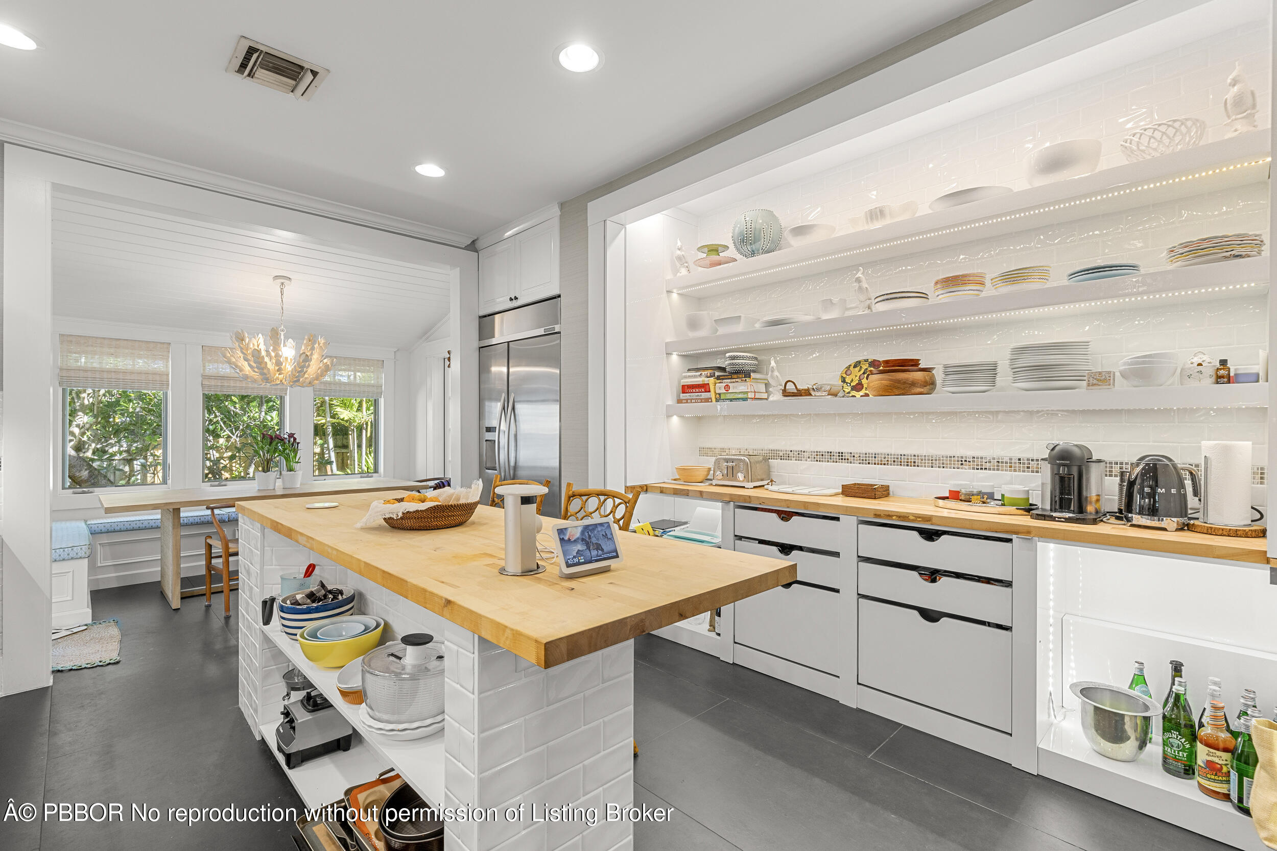 321 Croton Way West Palm Beach, FL 33401 - Photo 18 of 40 a kitchen that has a lot of cabinets in it
