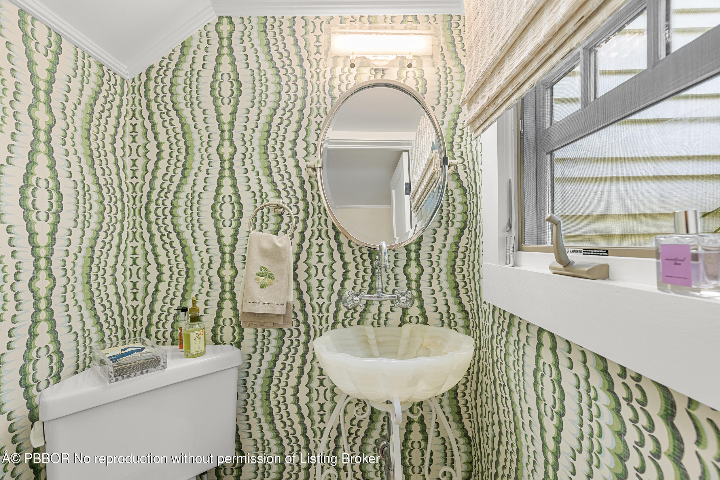 321 Croton Way West Palm Beach, FL 33401 - Photo 22 of 40 a bathroom with a sink and a mirror