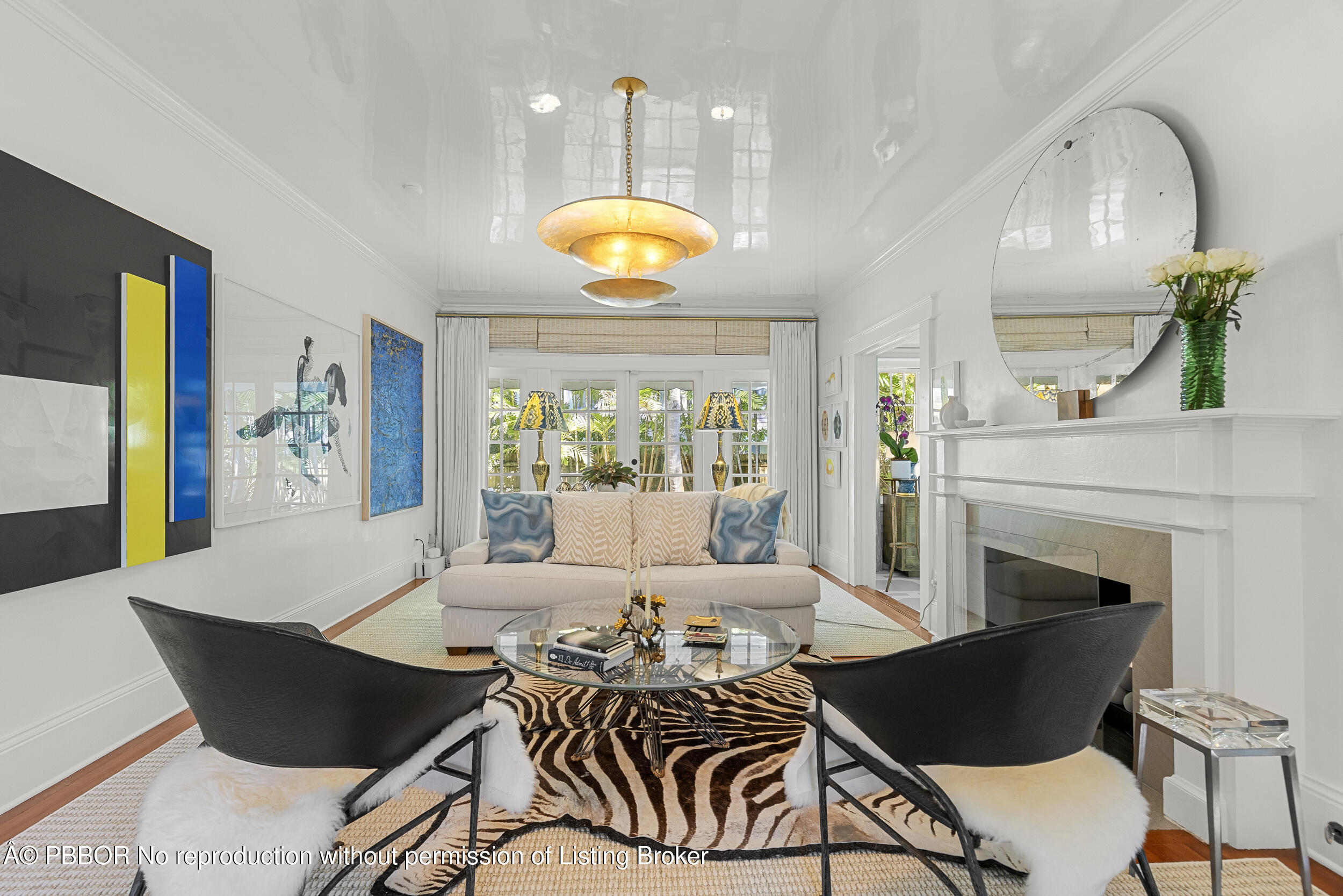 321 Croton Way West Palm Beach, FL 33401 - Photo 7 of 40 a view of a dining room with furniture a fireplace and wooden floor