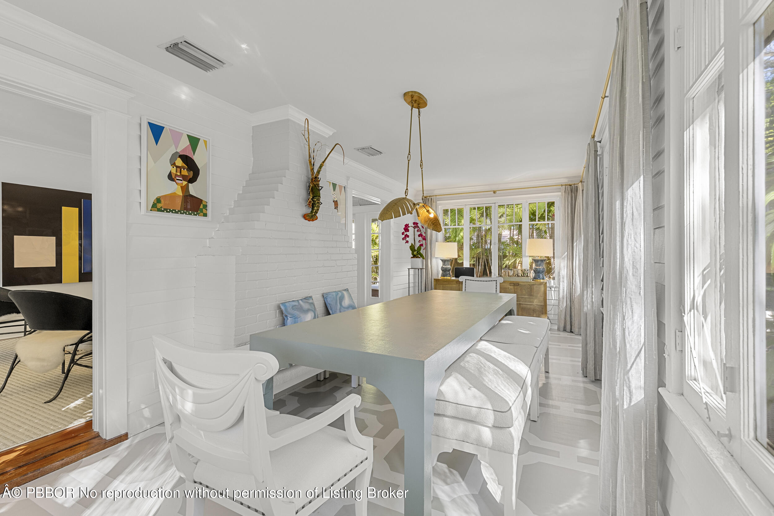 321 Croton Way West Palm Beach, FL 33401 - Photo 9 of 40 a dining room with furniture and a floor to ceiling window