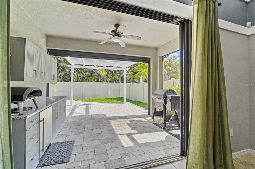 8903 Arabella Lane Seminole, FL 33777 - Photo 24 of 47 a view of a patio with a table and chairs