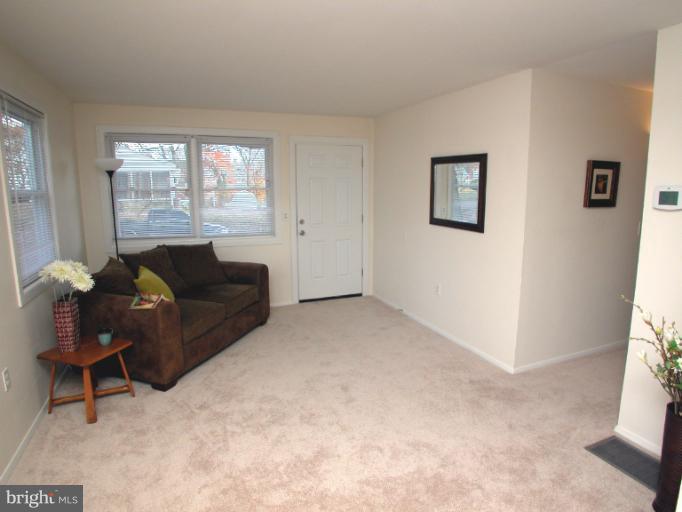 7920 Ridgely Oak Road Parkville, MD 21234 - Photo 11 of 13 a living room with furniture and a window