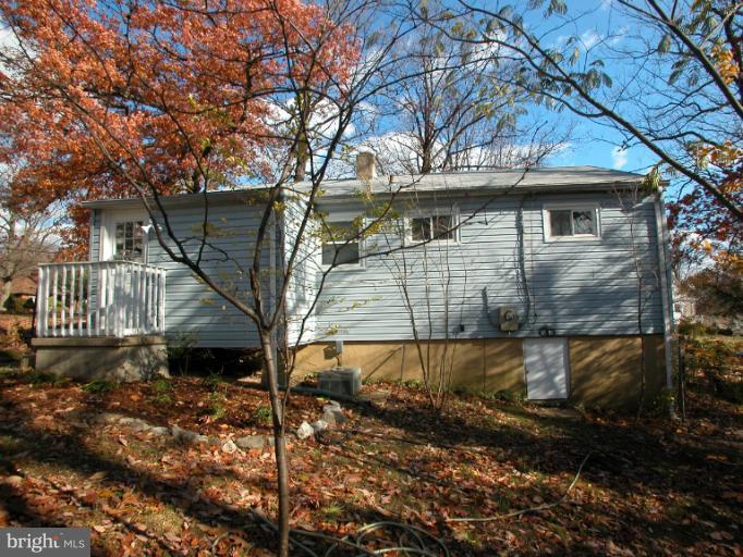 7920 Ridgely Oak Road Parkville, MD 21234 - Photo 8 of 13 a view of a house with a yard