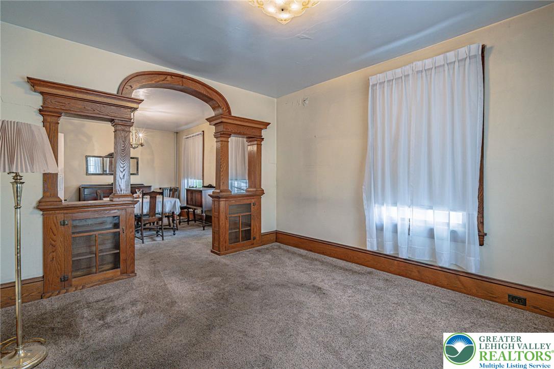 159 West Ridge Street Nesquehoning, PA 18240 - Photo 9 of 55 Ornate wood built-ins and archways define this adaptable living space with plush carpeting.