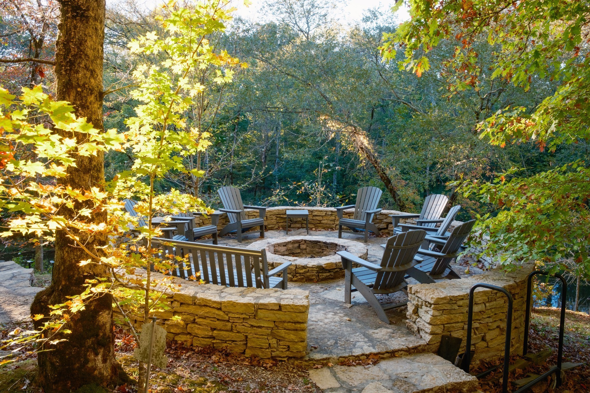 170 Warriors Path Road Summertown, TN 38483 - Photo 12 of 69 a view of a patio with table and chairs and potted plants with large trees