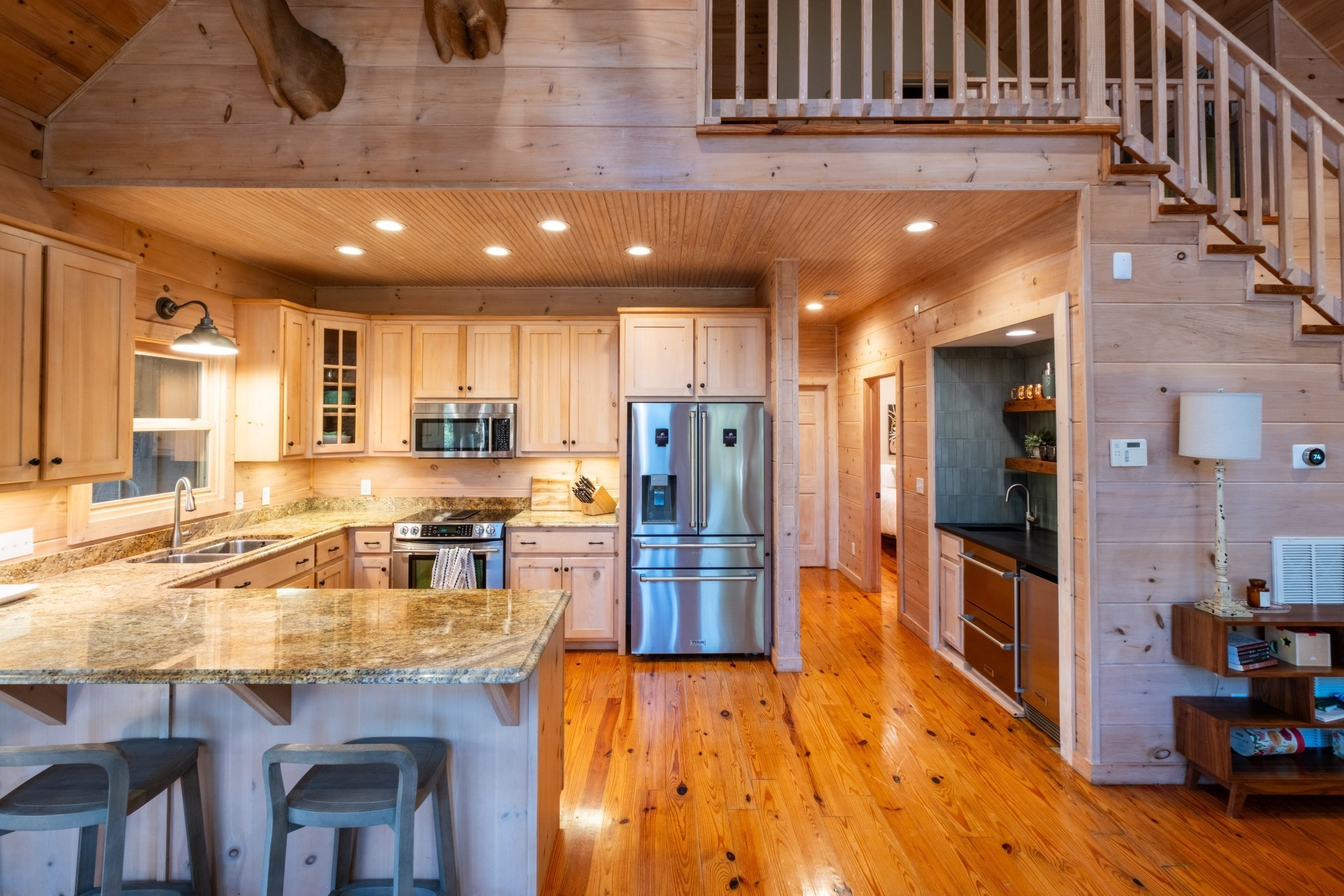 170 Warriors Path Road Summertown, TN 38483 - Photo 34 of 69 a kitchen with stainless steel appliances granite countertop a refrigerator a stove top oven a sink and dishwasher