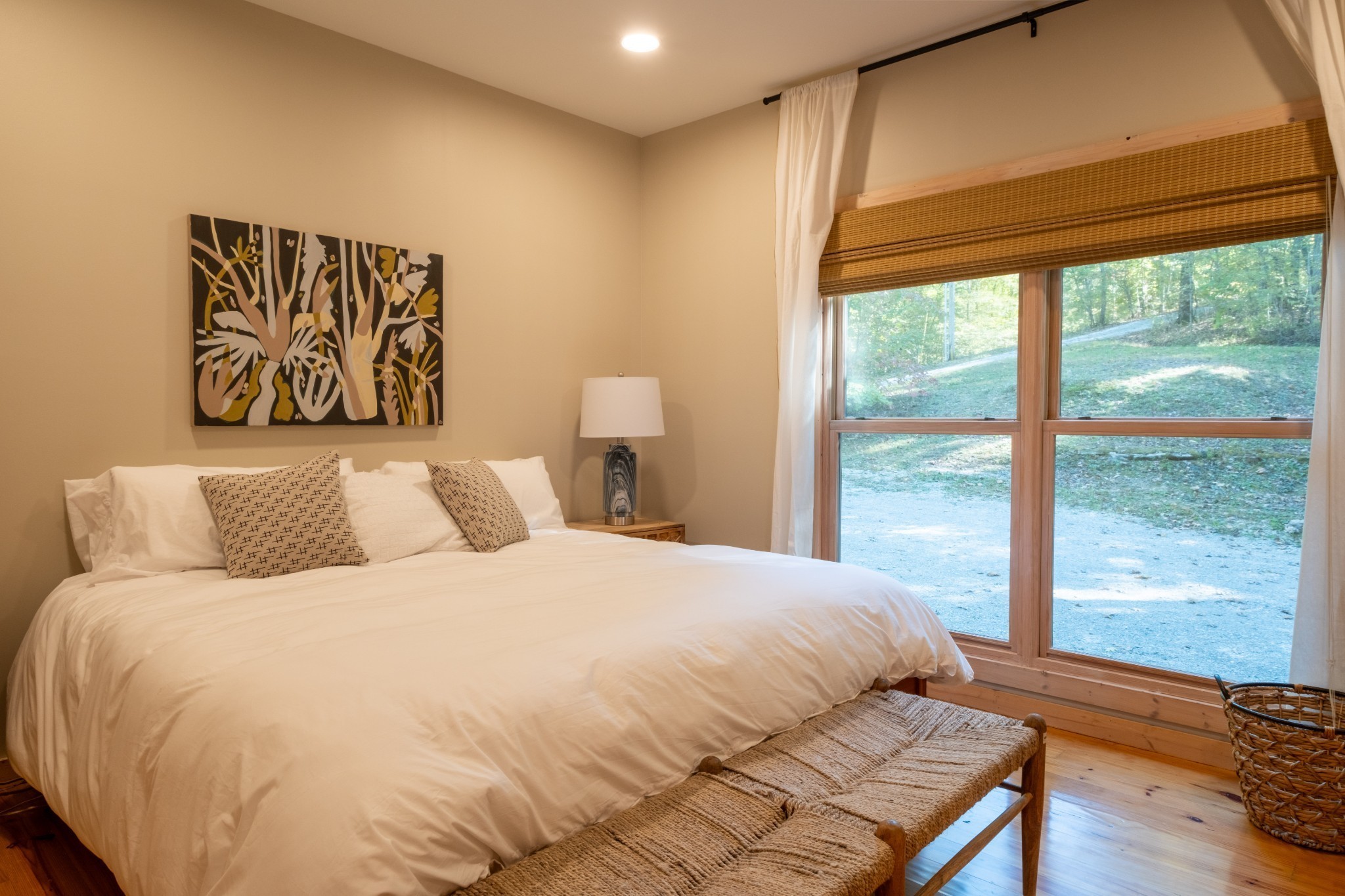 170 Warriors Path Road Summertown, TN 38483 - Photo 37 of 69 a bedroom with a large bed and a large window