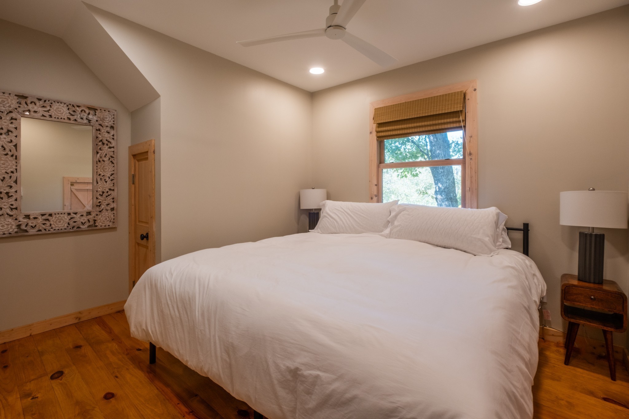 170 Warriors Path Road Summertown, TN 38483 - Photo 39 of 69 a large bed sitting in a bedroom next to a window