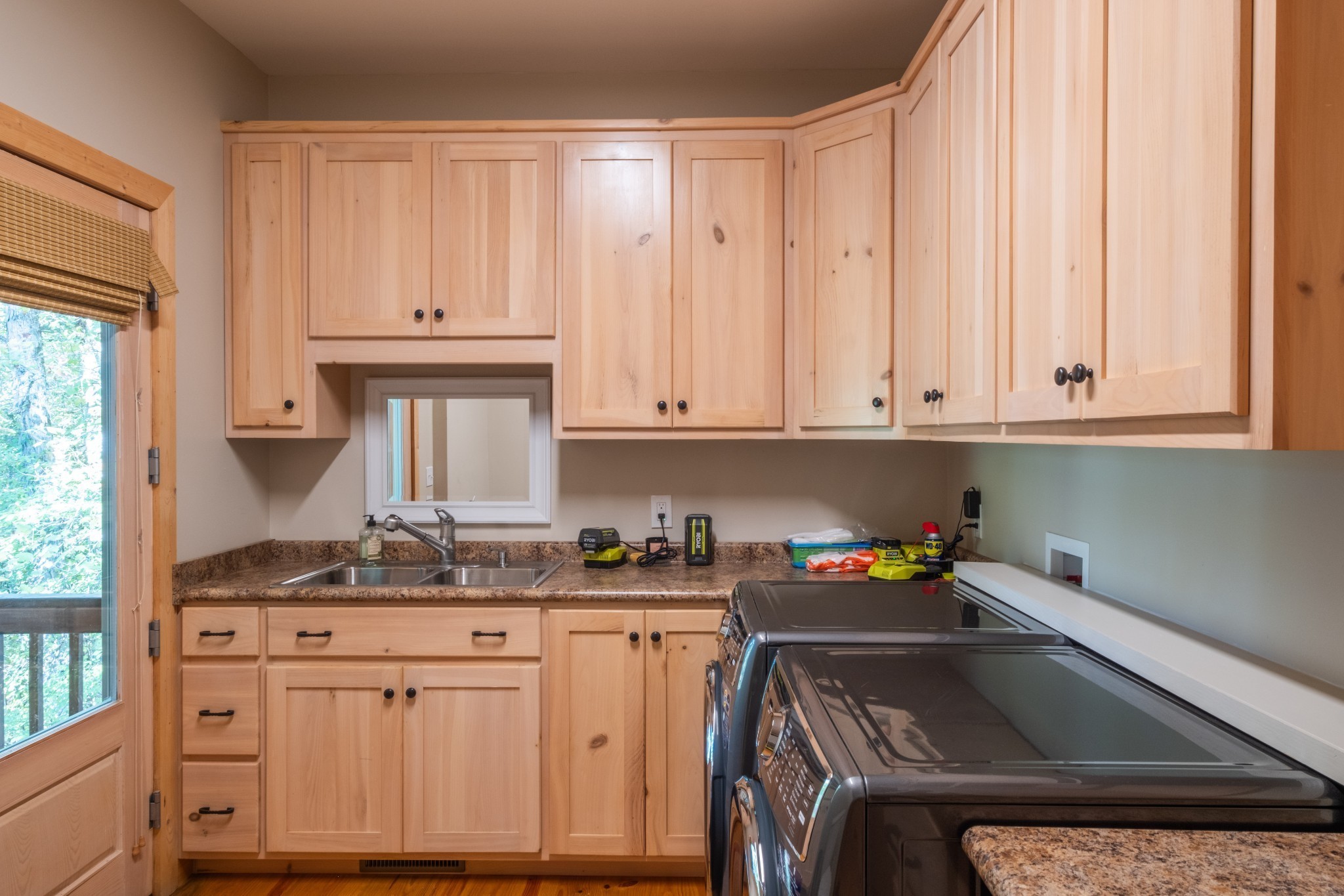 170 Warriors Path Road Summertown, TN 38483 - Photo 42 of 69 a kitchen with stainless steel appliances granite countertop a sink stove and cabinets