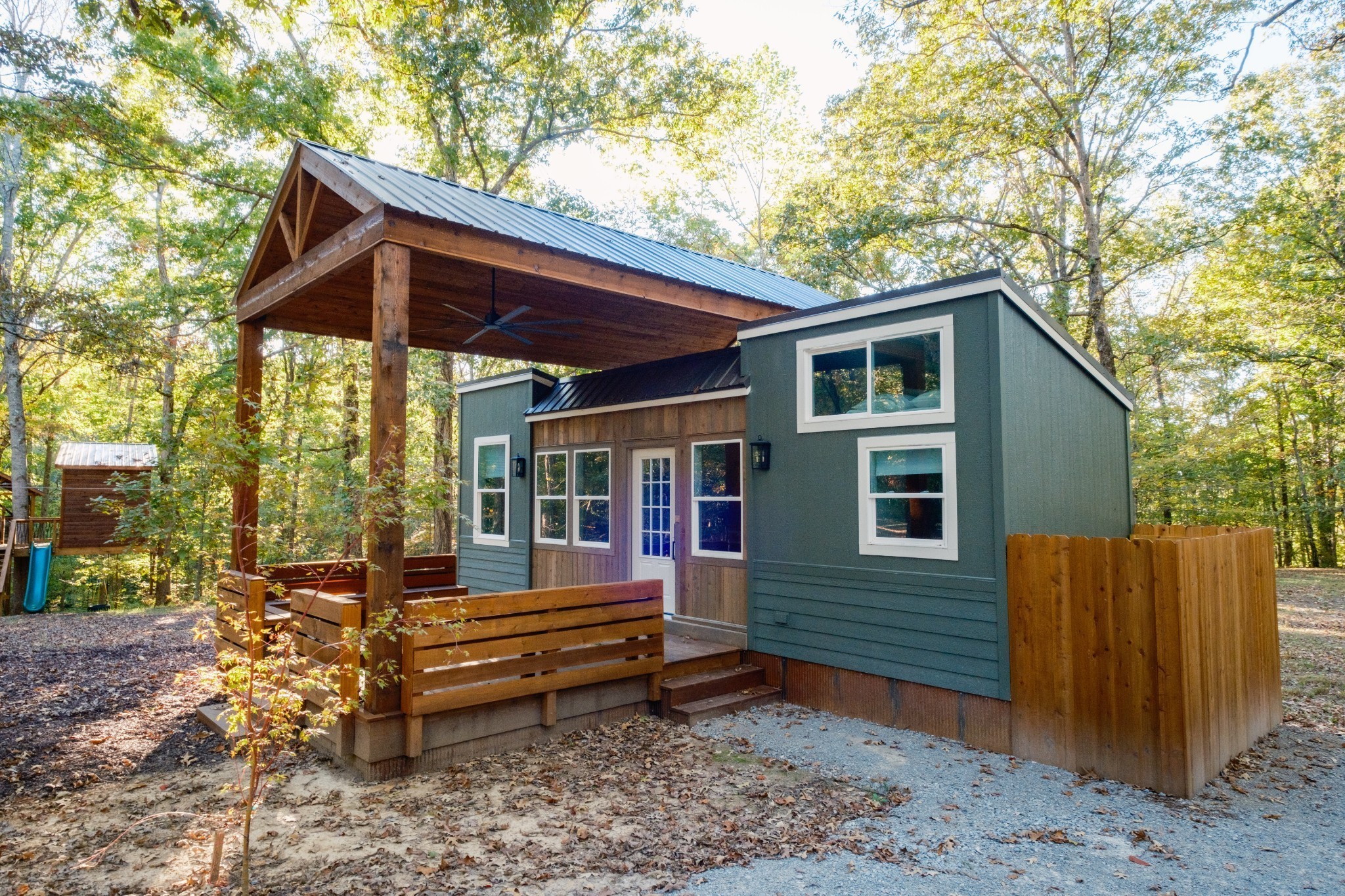 170 Warriors Path Road Summertown, TN 38483 - Photo 50 of 69 a backyard of a house with barbeque oven table and chairs