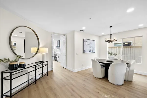 a living room with furniture a fireplace and a table